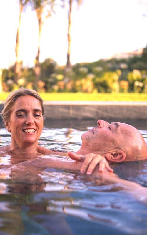 Tantra and the Elements of Nature – Connective Tantra School Mónica supporting Peter in a mindful water-based tantra practice, Connective Tantra School